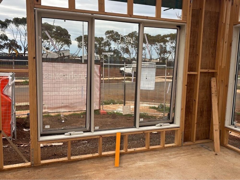 Window installation at frame stage, Tarneit