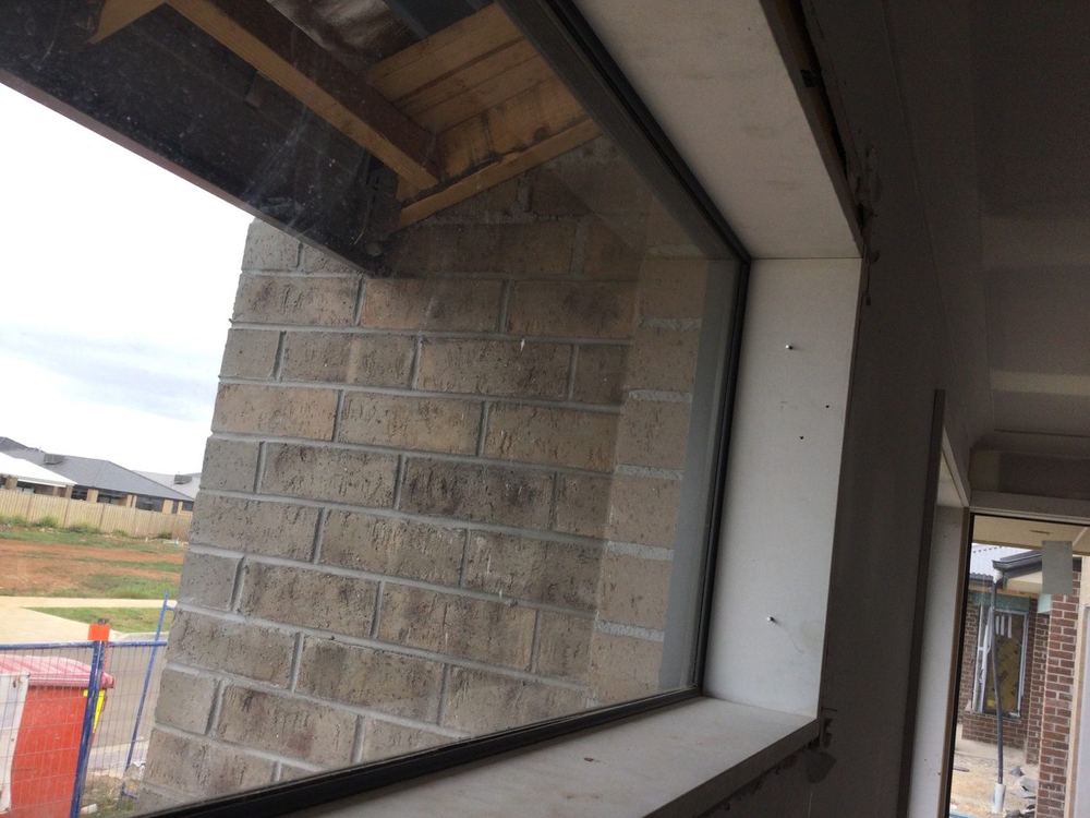 Lounge window set at the wrong height against the eaves, found during a waterproofing inspection in Tarneit